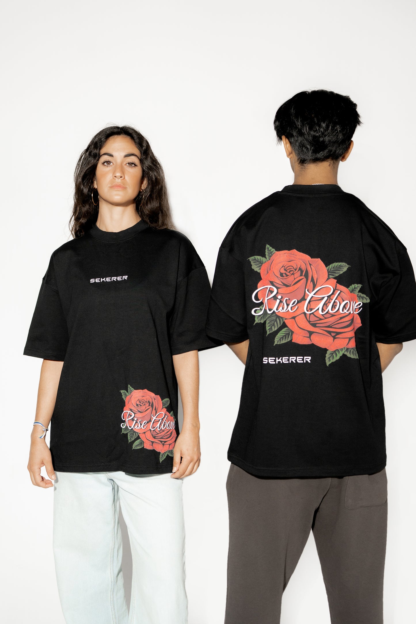 Male and female models wearing Ascend Rose oversized black streetwear t-shirt front and back view