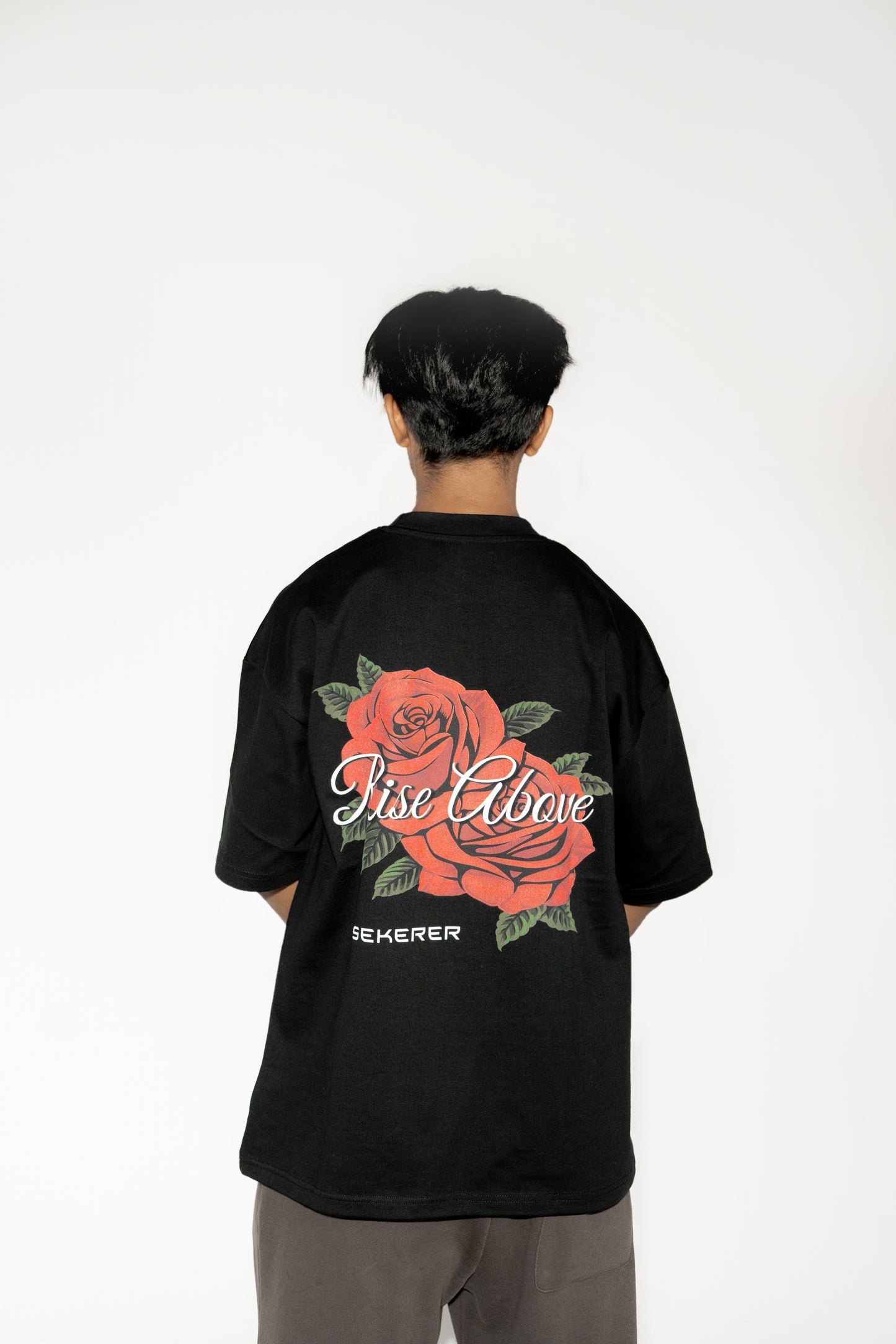 Ascend Rose oversized black t-shirt back view with large rose graphic print