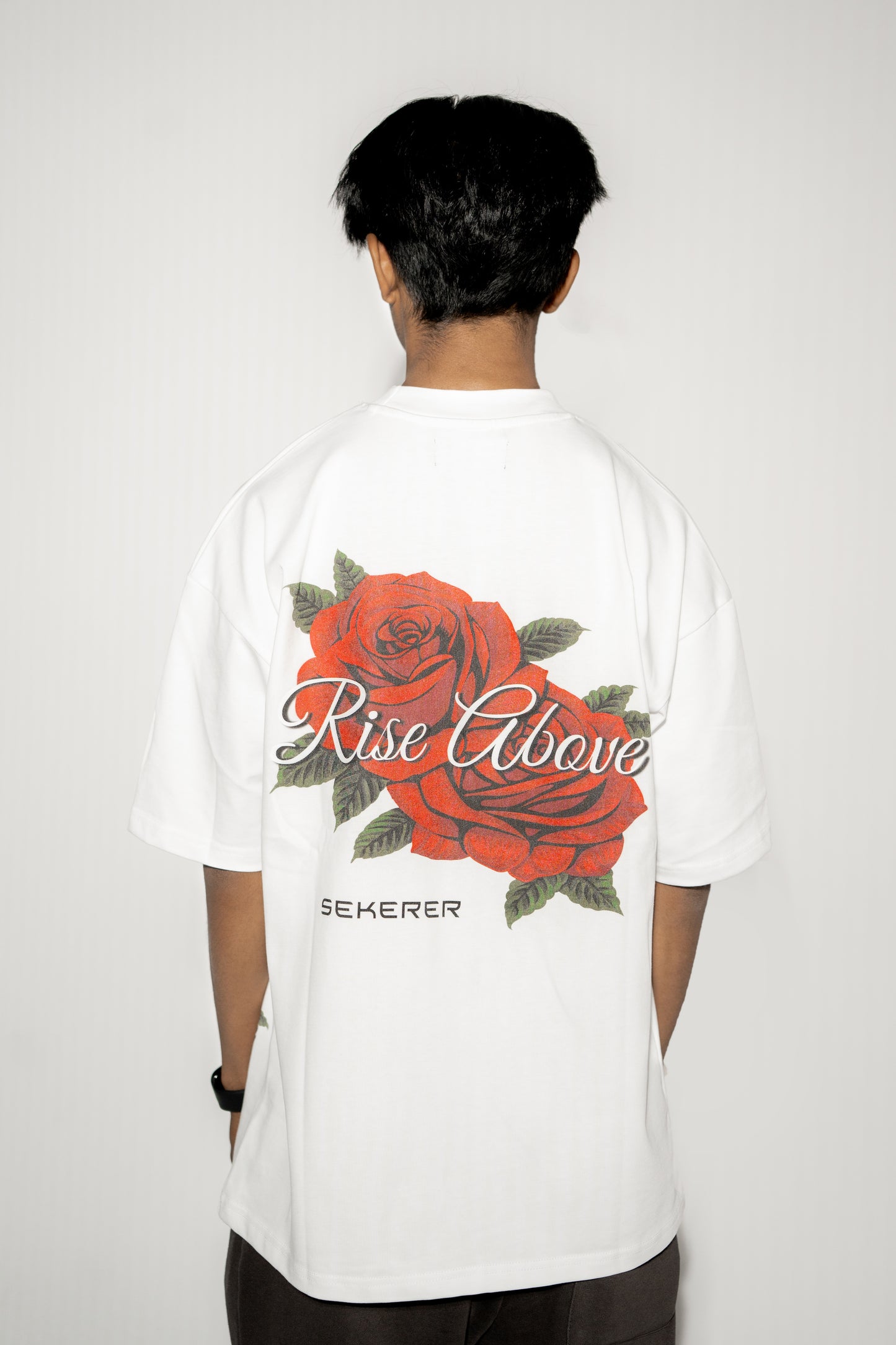 Ascend Rose oversized white t-shirt back view with large rose graphic print