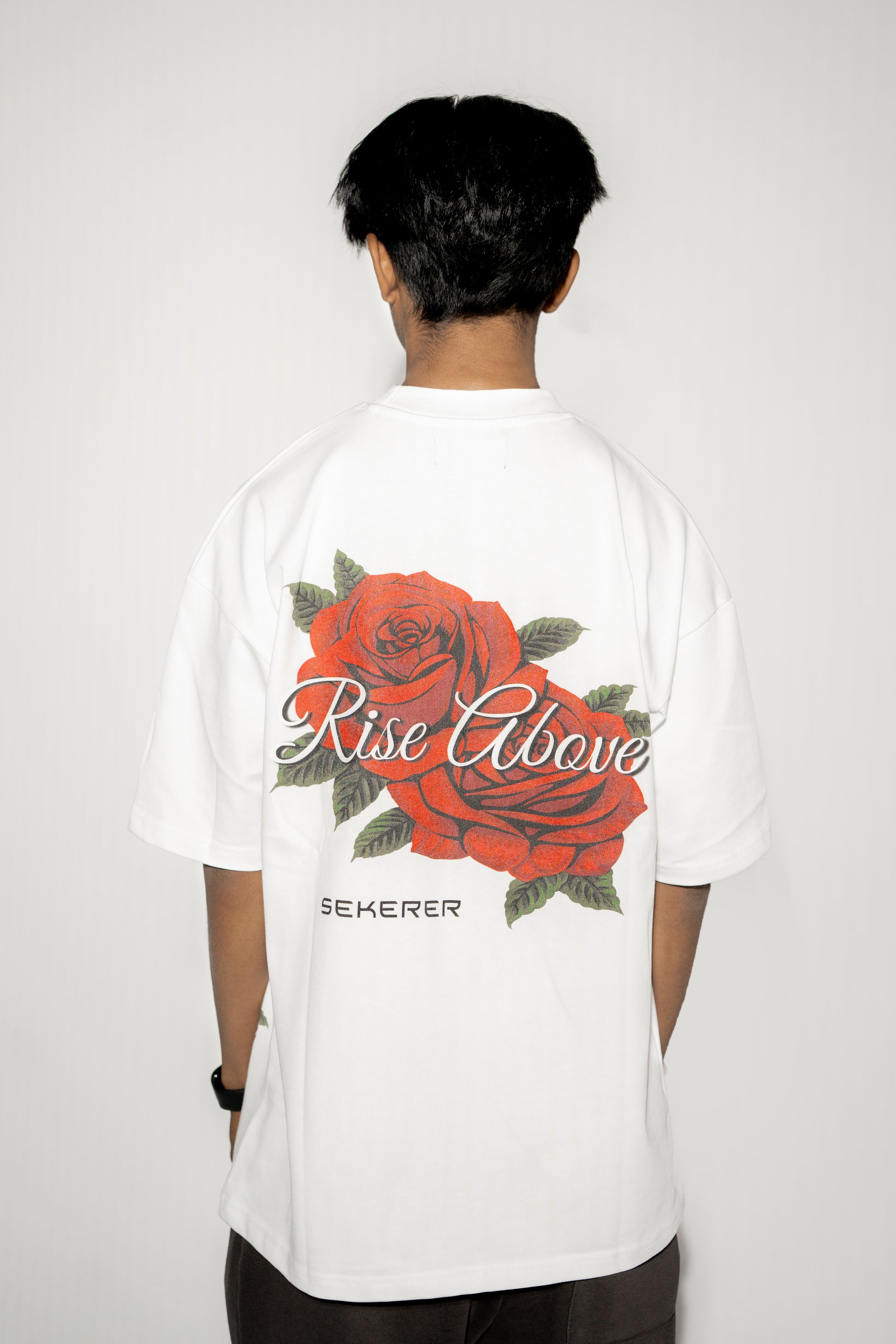 Ascend Rose oversized white t-shirt back view with large rose graphic print